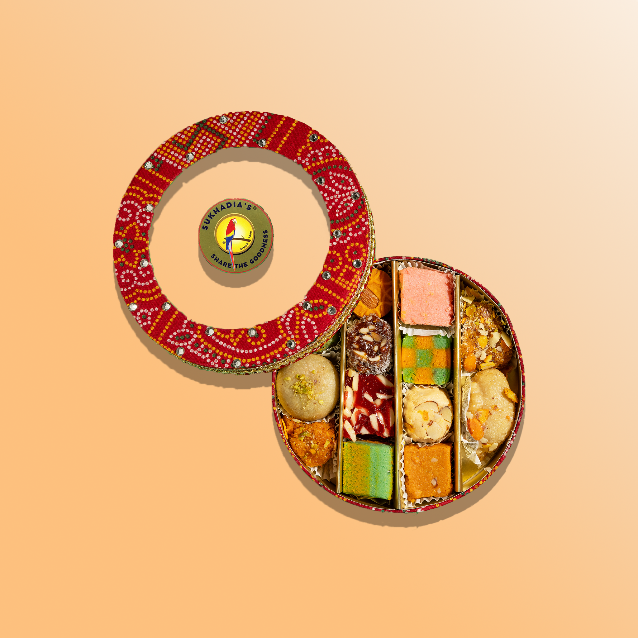Red Bandhani and Gold Sweets & Nuts Round Combo